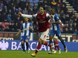 Mikel Arteta celebra una anotación en el partido contra los Wigan. AFP  /