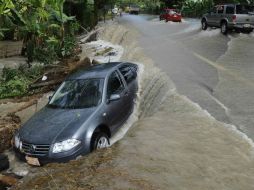 El desbordamiento del río Pichucalco causa inundaciones. EFE  /
