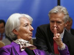 En la imagen, Lagarde y Rice conversan. ARCHIVO  /