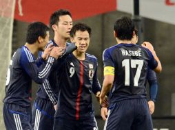 El cuadro asiático festeja su victoria en el principio de la Fecha FIFA. AFP /