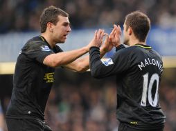 Jugadores del Chelsea celebran el triunfo sobre el Wigan. AFP /