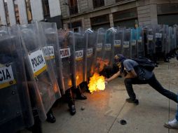 Aspecto de los disturbios del 1 de diciembre en DF. ARCHIVO /