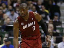 Wade logra 24 puntos durante el juego. A Miami le faltan 11 triunfos para igualar la mejor marca de la historia. AP /