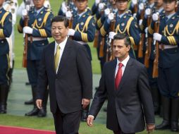 El presidente chino, Xi Jinping, y Enrique Peña Nieto. AP /
