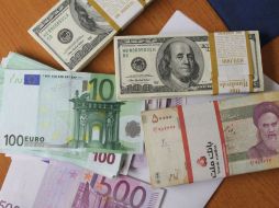 El euro y el yen caen frente a un dólar fortalecido por la publicación de cifras tranquilizadoras sobre el empleo en EU. ARCHIVO /