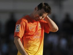 Lio sale lesionado en el duelo ante el Atleti y deja a su equipo mermado en la recta final. AP /