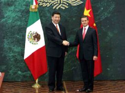 El presidente Enrique Peña Nieto al lado de su homólogo chino Xi Jinping. NTX /