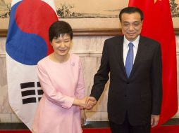 Park Geun-hye y Xi Jinping, acordaron en Beijing trabajar conjuntamente para reiniciar un diálogo ''lo antes posible''. AP /