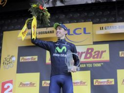 El ciclista portugués celebra en el podium su victoria tras disputar la 19ª etapa del Tour de Francia. EFE /