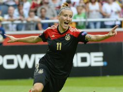 Mittag celebra la anotación que le da el campeonato a su país. AFP /