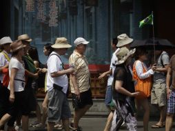 El número de turistas extranjeros que visitan la capital china cayó 15% en los primeros seis meses del año a 1.9 millones. AP /