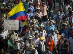 Las calles de distintas ciudades en Colombia se llenaron de manifestantes que están a favor del paro agrario en este país. AFP /