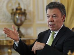 Juan Manuel Santos afirmó que su país no está para derrotas ni para bajar los brazos. AP /