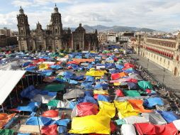 Los maestros de la CNTE alentaron a sus compañeros a no seguir empacando sus pertenencias. NTX /