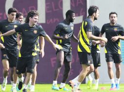 El cuadro culé encabezado por Lionel Messi (frente izq) es uno de los favoritos para levantar la ''Orejona''. AFP /