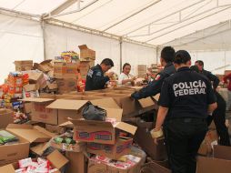 La Segob, en conjunto con la Policía Federal, SEDENA y Marina continúan con recolección de despensas. ARCHIVO /