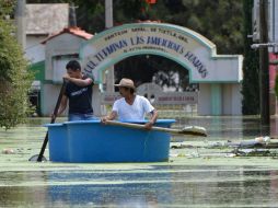 Según la Segob, las lluvias dejan unas 59 mil personas evacuadas de sus comunidades ante el riesgo de deslaves o inundaciones. AP /