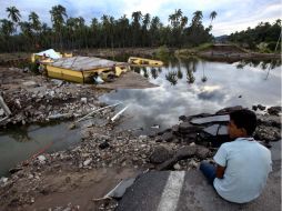 Habitantes de Guerrero esperan regresar a sus casas luego de que el nivel de agua ha descendido. SUN /