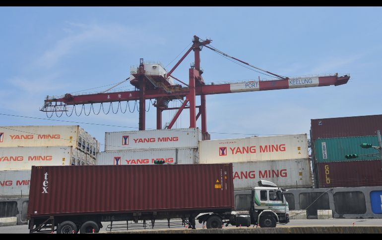 A container truck drives along a pier at Taiwan