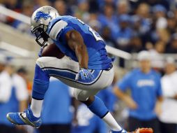 Reggie Bush (I) fue de nuevo figura para los Leones, que derrotaron a los Osos. AP /