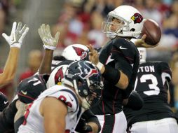 Carson Palmer sumó dos pases de anotación para derrotar a los Texanos. AP /