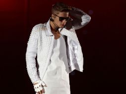 En Colombia y Brasil el cantante también pintó grafitis, aunque en este último país tuvo problemas con la ley. AP /