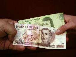 Los consumidores podrán presentar billetes de alta denominación, quemados, rotos, rayados o parchados, pero que conserven su valor. ARCHIVO /