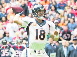 Peyton Manning lanzó cuatro anotaciones y ninguna intercepción.  /