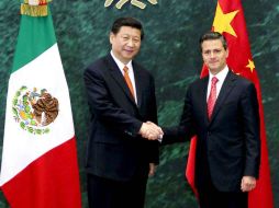 El Ejecutivo federal recibió en México a nueve mandatarios de diversos países. En la imagen, Peña y su homólogo chino, Xi Jinping. ARCHIVO /