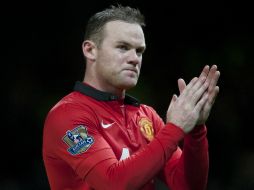 Wayne Rooney termina el juego con frustración por la caída. AP /