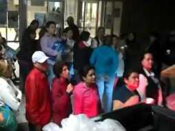 Reparten comida y regalos en el Centro de Tampico, hospitales y en la central camionera. ESPECIAL /