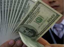 La moneda se compra en un mínimo de 12.55 pesos. ARCHIVO /