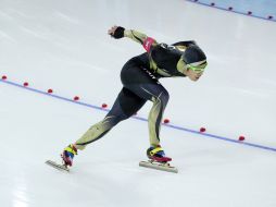 Joji Kato del equipo de Japón entran sobre la pista. AP /