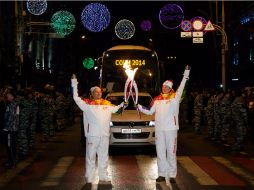 La flama ha arribado a la ciudad sede, entre la polémica y las protestas. AFP /