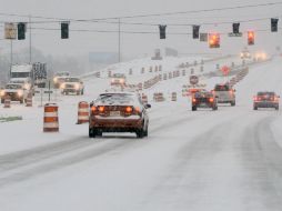 Una nueva tormenta polar comenzó a caer hoy en el norte de Alabama. AP /