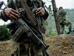 En la imagen guerrilleros de Las FARC. ARCHIVO /