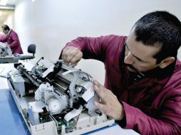 Costo. La revaluación del yuanes una factor que analizan las empresas. AP /