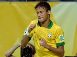 Neymar Junior podrá exhibir su gran futbol en su casa, aunque en España no ha despegado, dice Scolari. ARCHIVO /