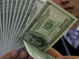 El tipo de cambio para solventar obligaciones en moneda extranjera pagaderas de la República es de 13.1371 pesos. ARCHIVO /