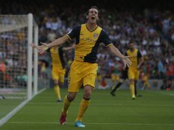 El gol de Diego Godín da el empate al Atlético de Madrid y, con ello, la copa de la liga española. AP /