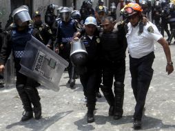 La gresca registrada ayer en San Bartolo Ameyalco dejó más de 100 heridos. ARCHIVO /