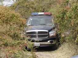 Autoridades acudieron al llamado sobre el descubrimiento de dos personas sin vida en dos municipios de Jalisco. ARCHIVO /