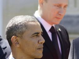 Según la Casa Blanca, la conversación duró un cuarto de hora en el interior de un castillo donde almorzaron los gobernantes. AFP /
