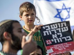 Desde que encontraron los cuerpos de los jóvenes, en Israel han realizado manifestaciónes en la que proclaman la venganza. AFP /