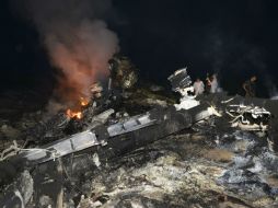 Autoridades continúan sus investigaciones en la zona del siniestro. AFP /