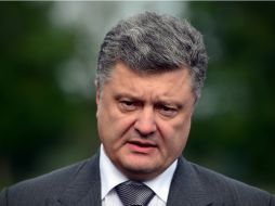 Petro Poroshenko (foto) y Vladimir Putin constatan el cumplimiento del alto ea fuego bilateral decretado en el este de Ucrania. AFP /