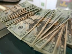 El tipo de cambio para solventar obligaciones en moneda extranjera pagaderas en el país es de 13.2369 pesos. EL INFORMADOR  ARCHIVO  /