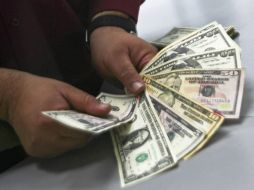 El tipo de cambio para solventar obligaciones en moneda extranjera pagaderas en el país es de 13.4835 pesos. NTX / ARCHIVO