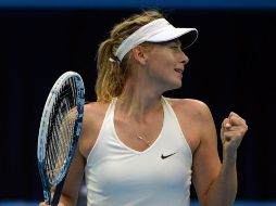 Sharapova es la actual cuatro del planeta; se instala en la final del certamen al derrotar a la serbia Ana Ivanovic. AFP / G. Chai Hin