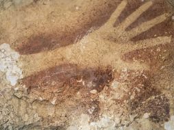 La pintura con más edad corresponde al contorno de una mano humana. AP / K. Riza
